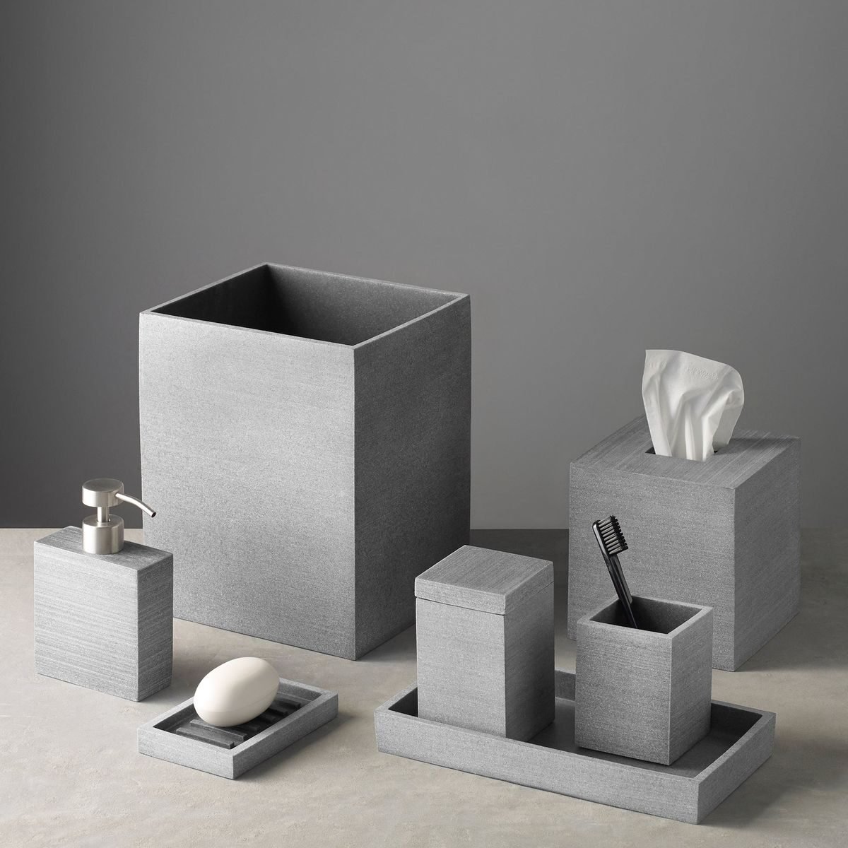 Sand-finish stone washroom accessory set — MARK UAE